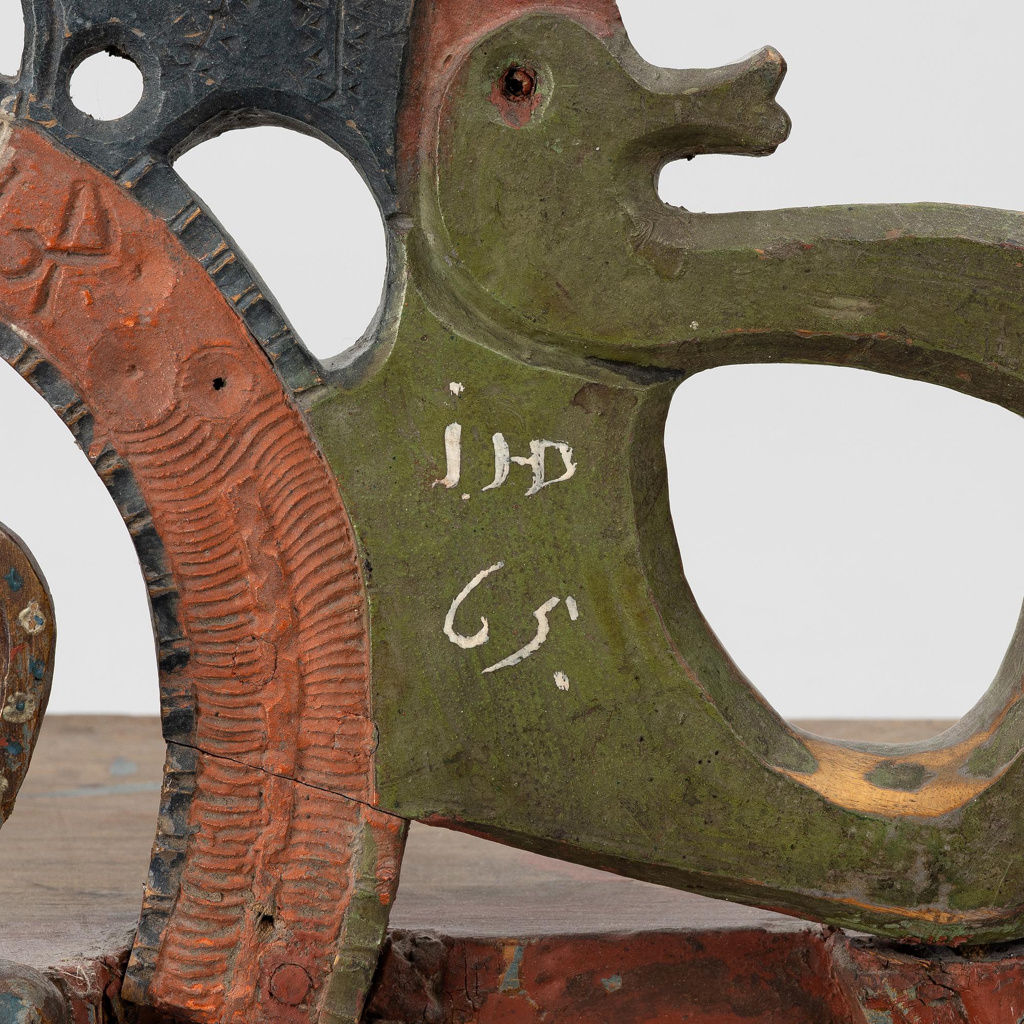A Swedish carved and painted folk art shelf from Hälsingland, 18th / 19th century.