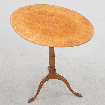 A 19th Century birch tilt top table.