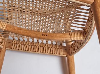 Hans J. Wegner, an oak and rattan 'The Chair', JH501, Johannes Hansen, Denmark.