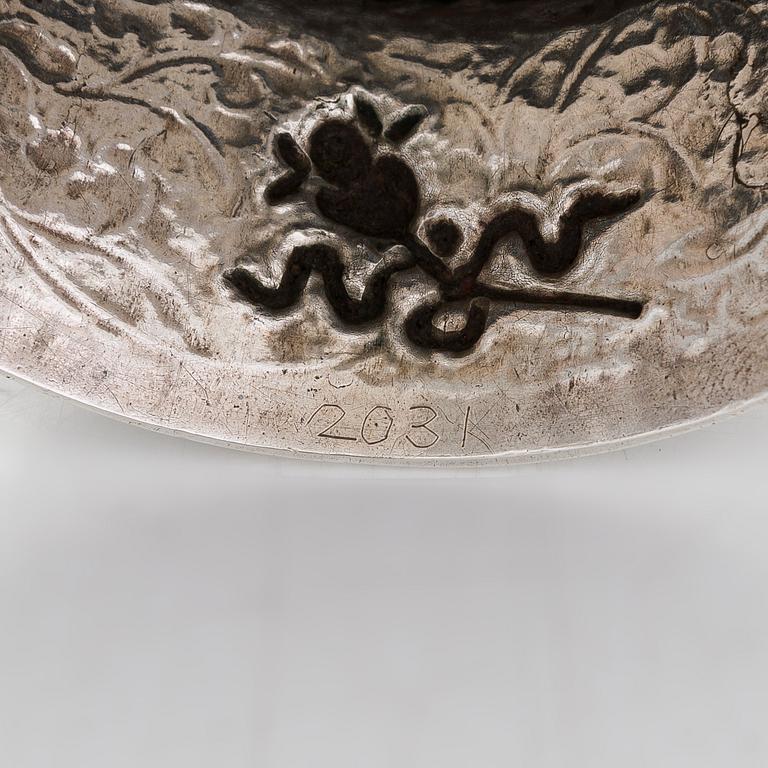 A Tibetan butter lamp, silver, early 19th century.