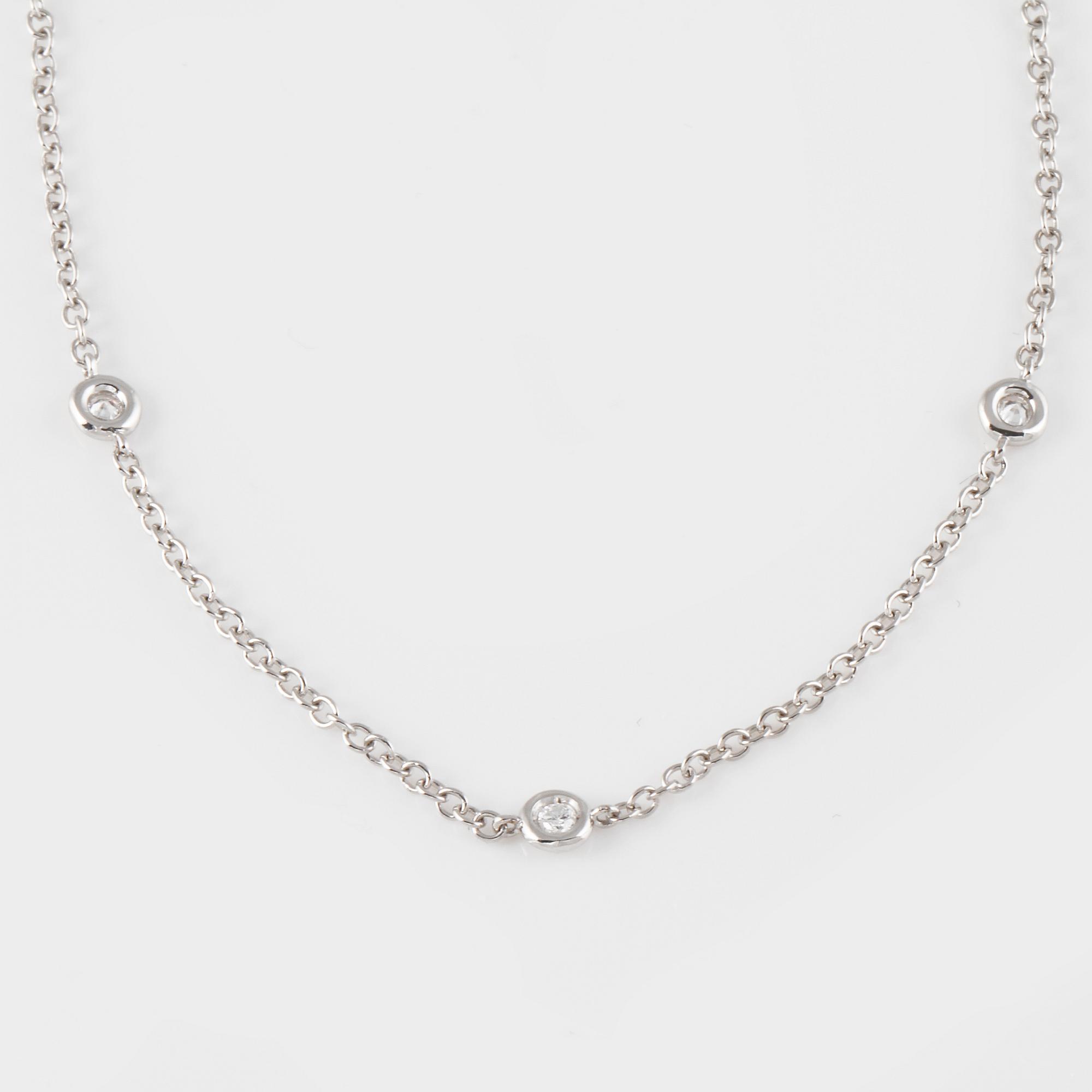 COLLIER, 18K vitguld med 12 briljantslipade diamanter ca 0.30 ct. Vikt 3,8 gram.
