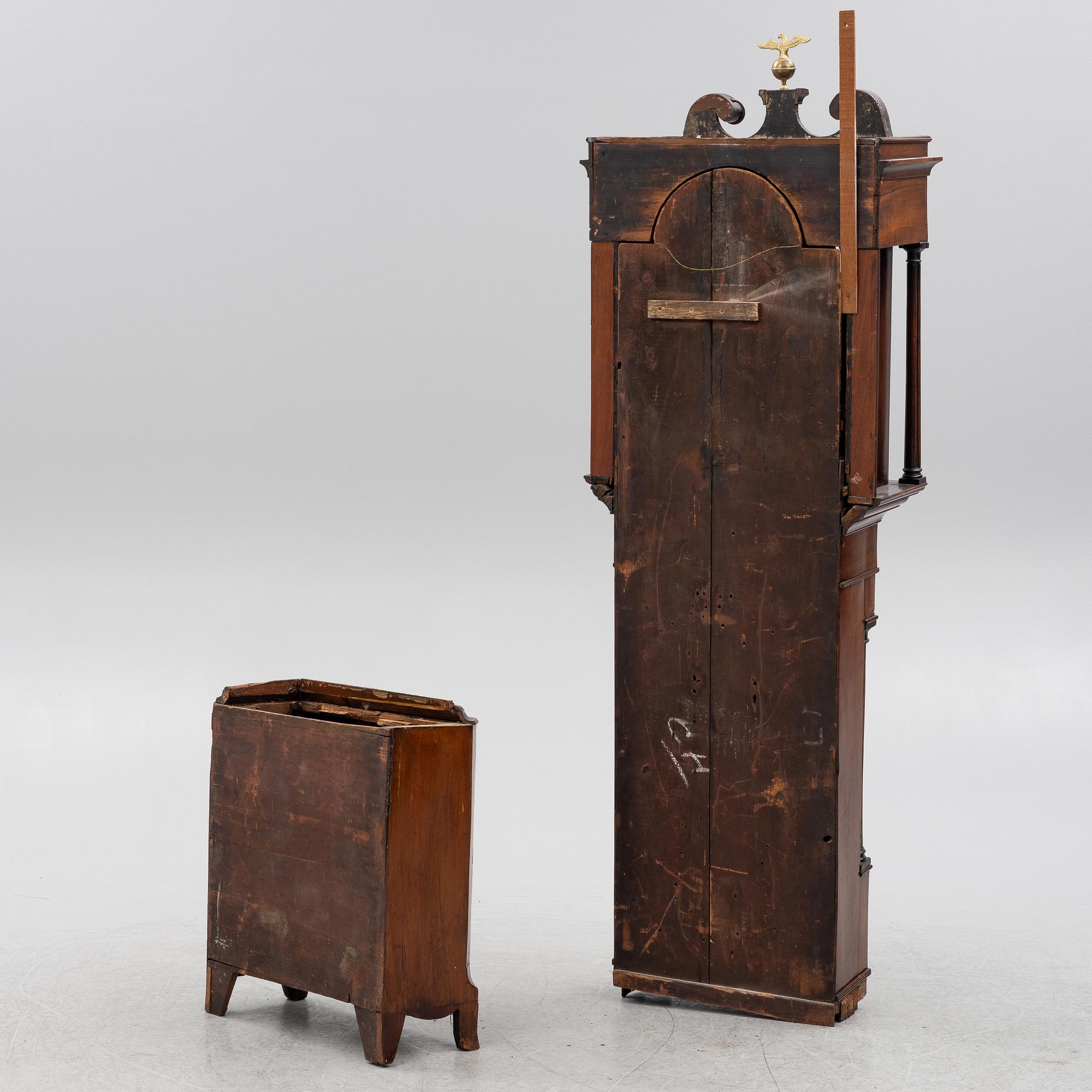 A long-case clock, England, 19th century.