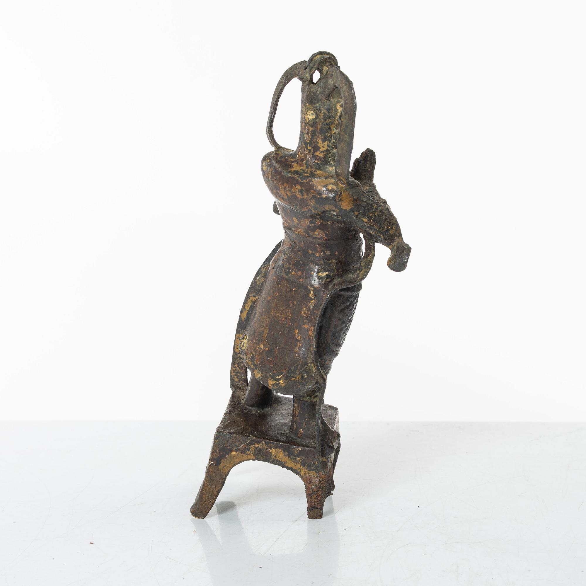 A Chinese bronze figure of a guardsman, Ming dynasty (1368-1644).