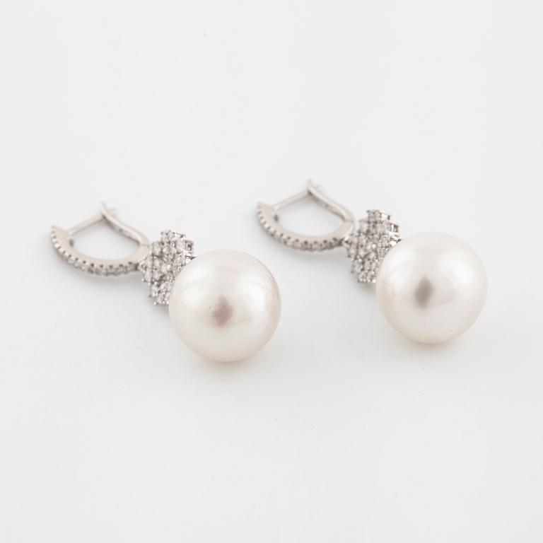 A pair of cultured pearl and brilliant cut diamond earrings.