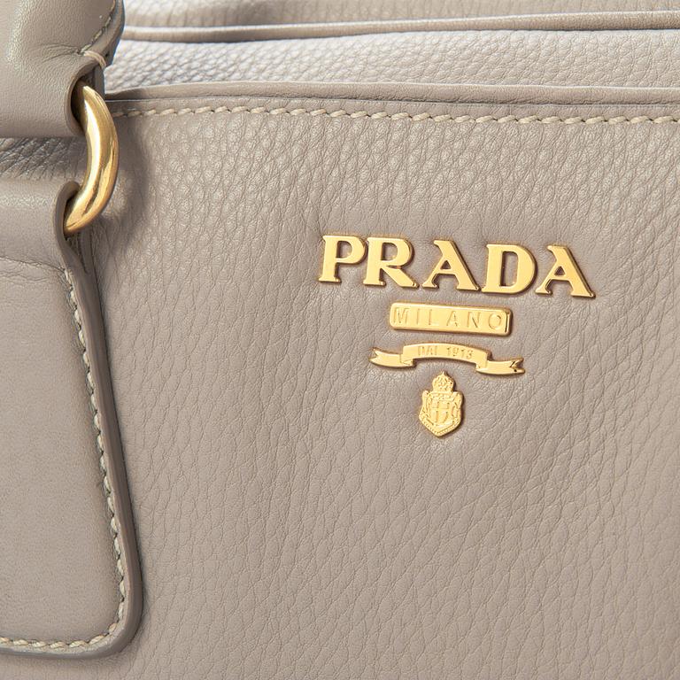 A leather handbag by Prada.