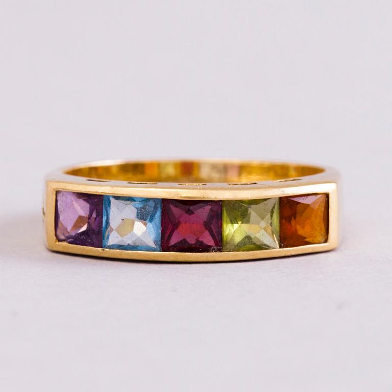 A 18K gold ring with 5 different stones: citrine, amethyst, topaz, garnet, peridot and a small diamond. Probably H.Stern.