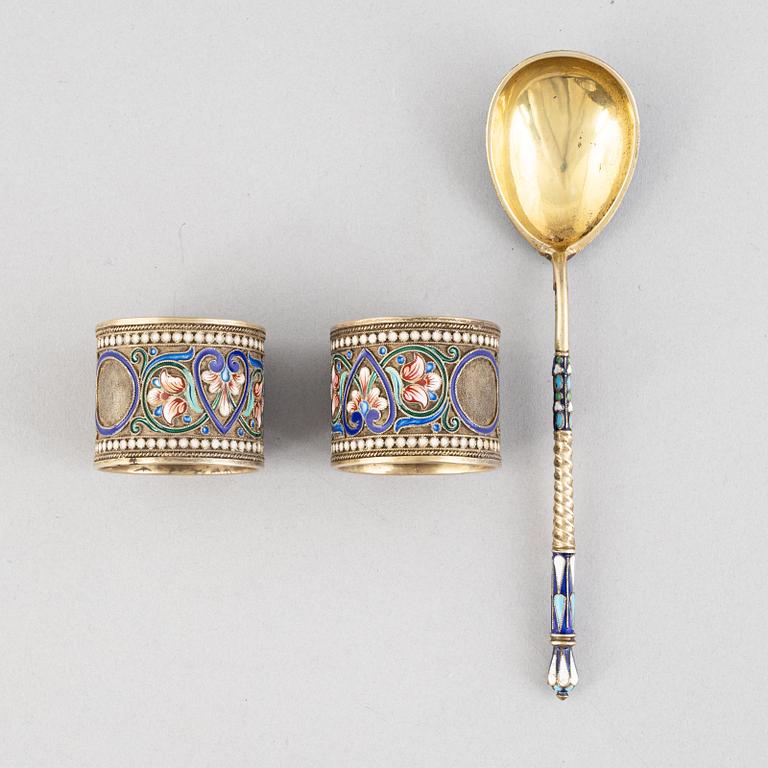 A Pair of Silver and Enamel Napkin Rings and Spoon, Russia 1896-1926.