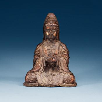 1259. A cast iron figure of a seated Guanyin, presumably late Ming dynasty.