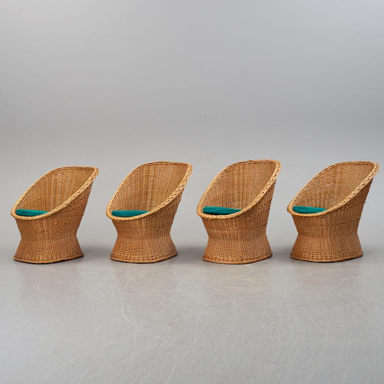 Four second half of the 20th century rattan easy chairs.