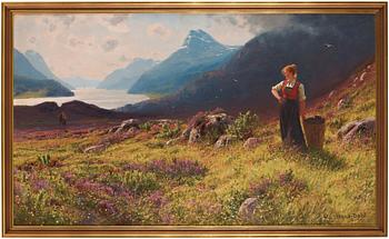 Hans Dahl, Woman in a fjord landscape.