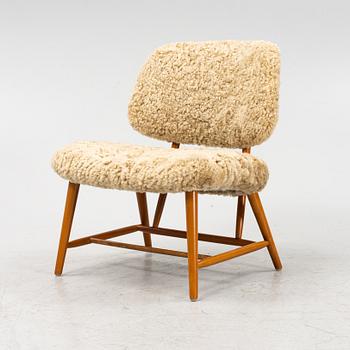 Alf Svensson, a 'TeVe' easy chair, with new sheepskin upholstery. Bra Bohag, Studio Ljungs Industrier, 1950's.