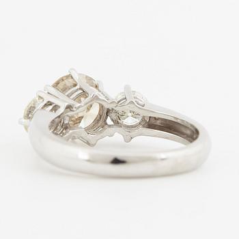 Fancy light yellowish brown round brilliant-cut diamond ring.