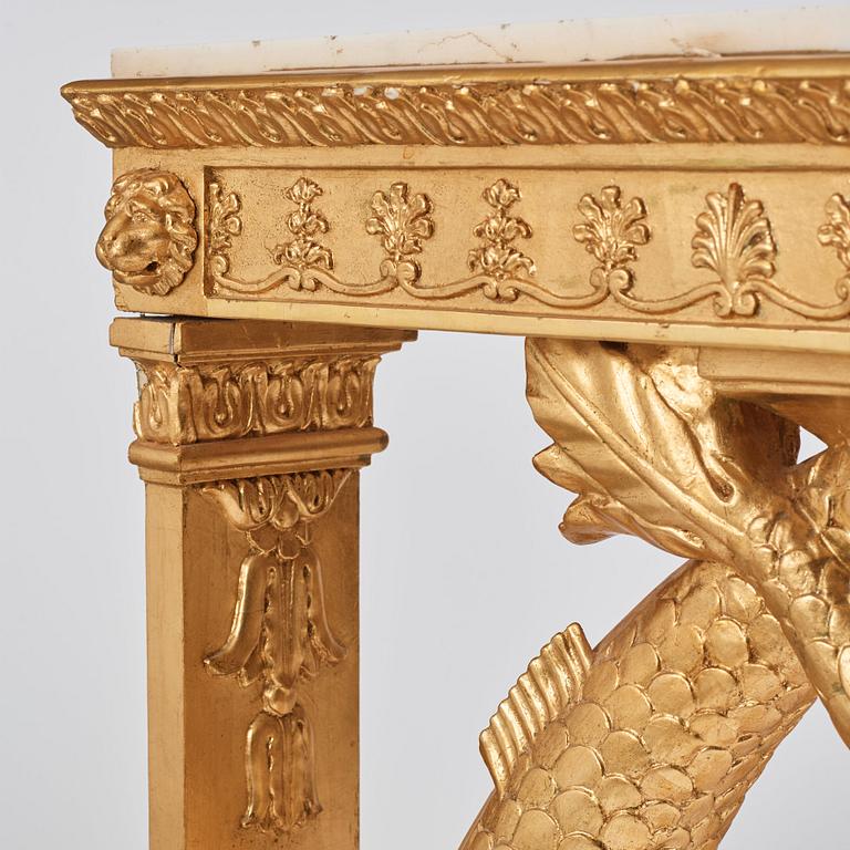 A pair of Swedish Empire carved and giltwood console tables, first half of the 19th century.