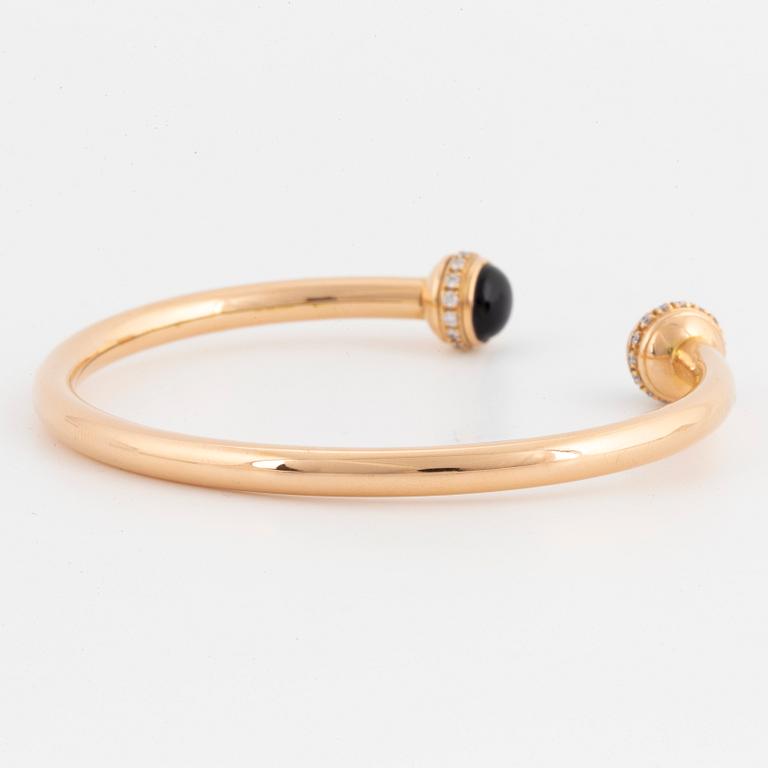 Piaget 18K rose gold, brilliant-cut diamonds and onyx cabochons.