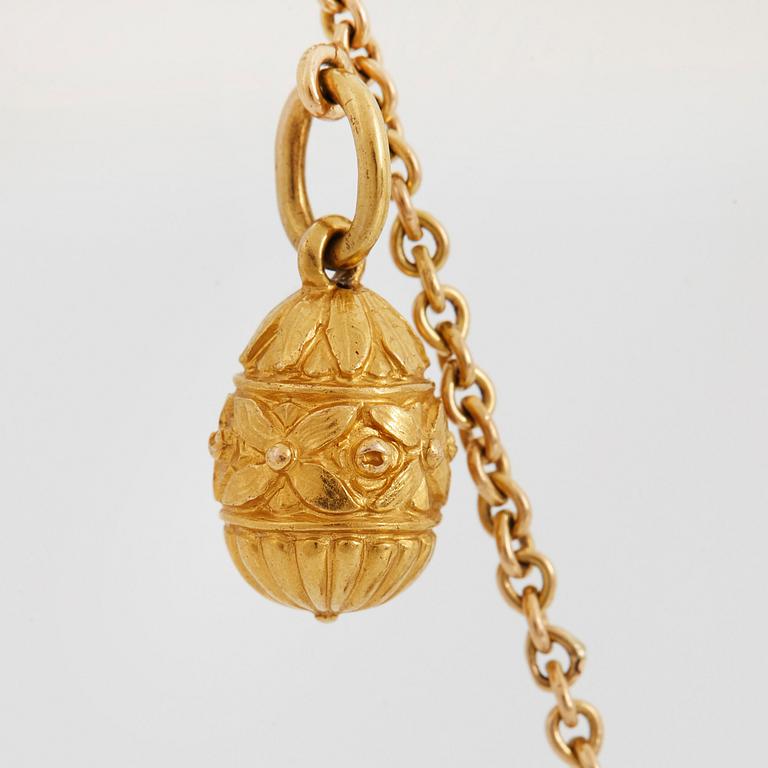 A FABERGÉ  GOLD Chain Necklace WITH 8 GOLD, ENAMEL ETC MINIATURE EASTER EGG PENDANTS, S.T PETERSBURG and 3 other.