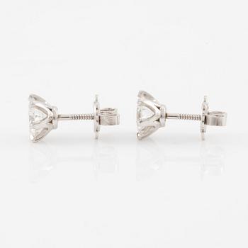 Brilliant-cut diamond stud earrings.