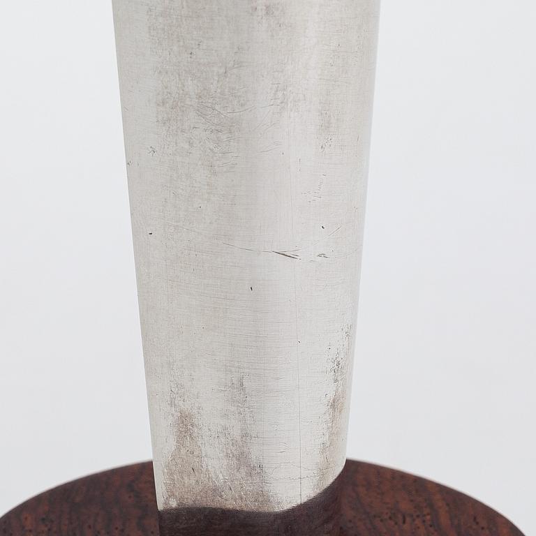 Tapio Wirkkala, a 'Liekki' (Flame) silver vase on a rosewood base, model TW 228,  Kultakeskus, Hämeenlinna 1962.