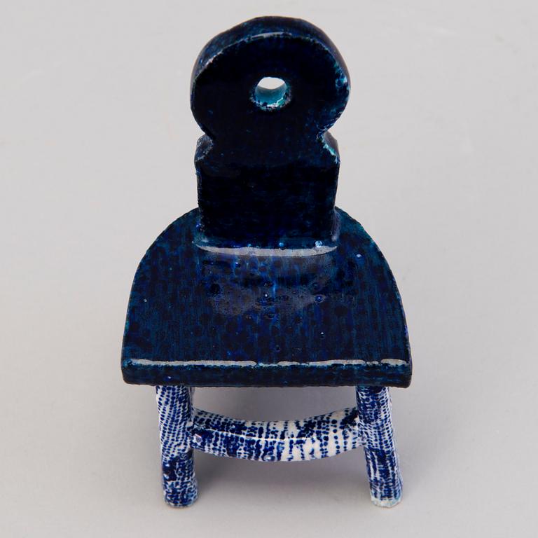 HEINI RIITAHUHTA, a porcelain miniature sculpture 'Chair' signed Heini Riitahuhta.