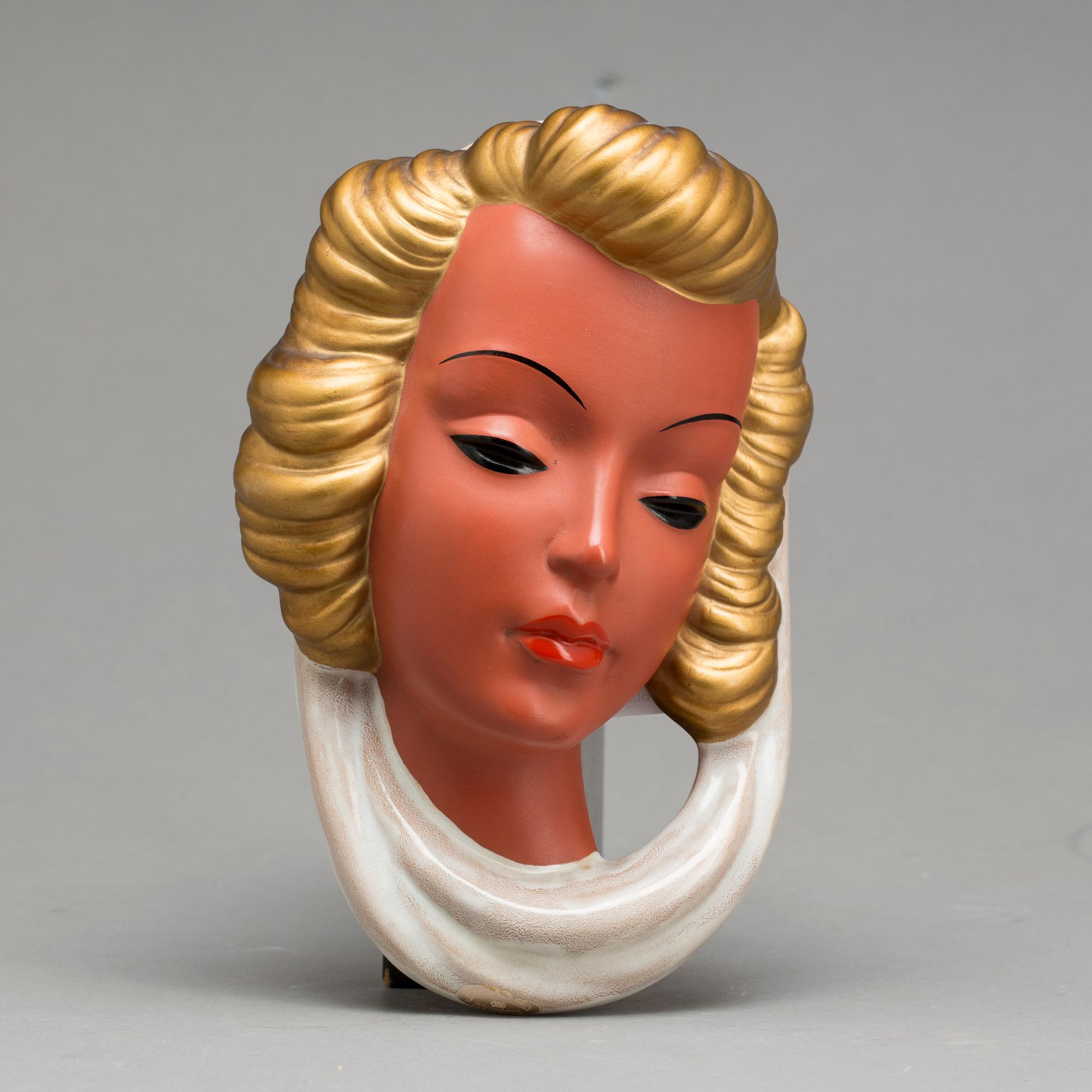 An Adolf Prischl terracotta wall mask for Goldscheider, mid 1900.