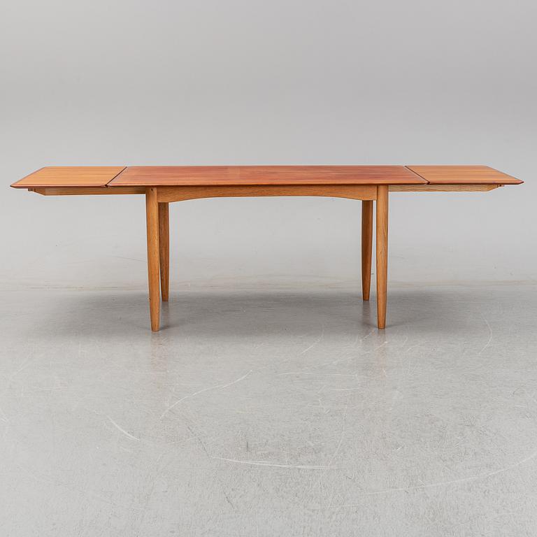A 1950/60's dining table from Slagelse Møbelvaerk A/S with two additional leaves.