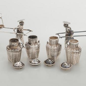 Four shakers in a pair of miniature rickshaws, sterling silver, maker's mark of Wai Kee, Hong Kong.