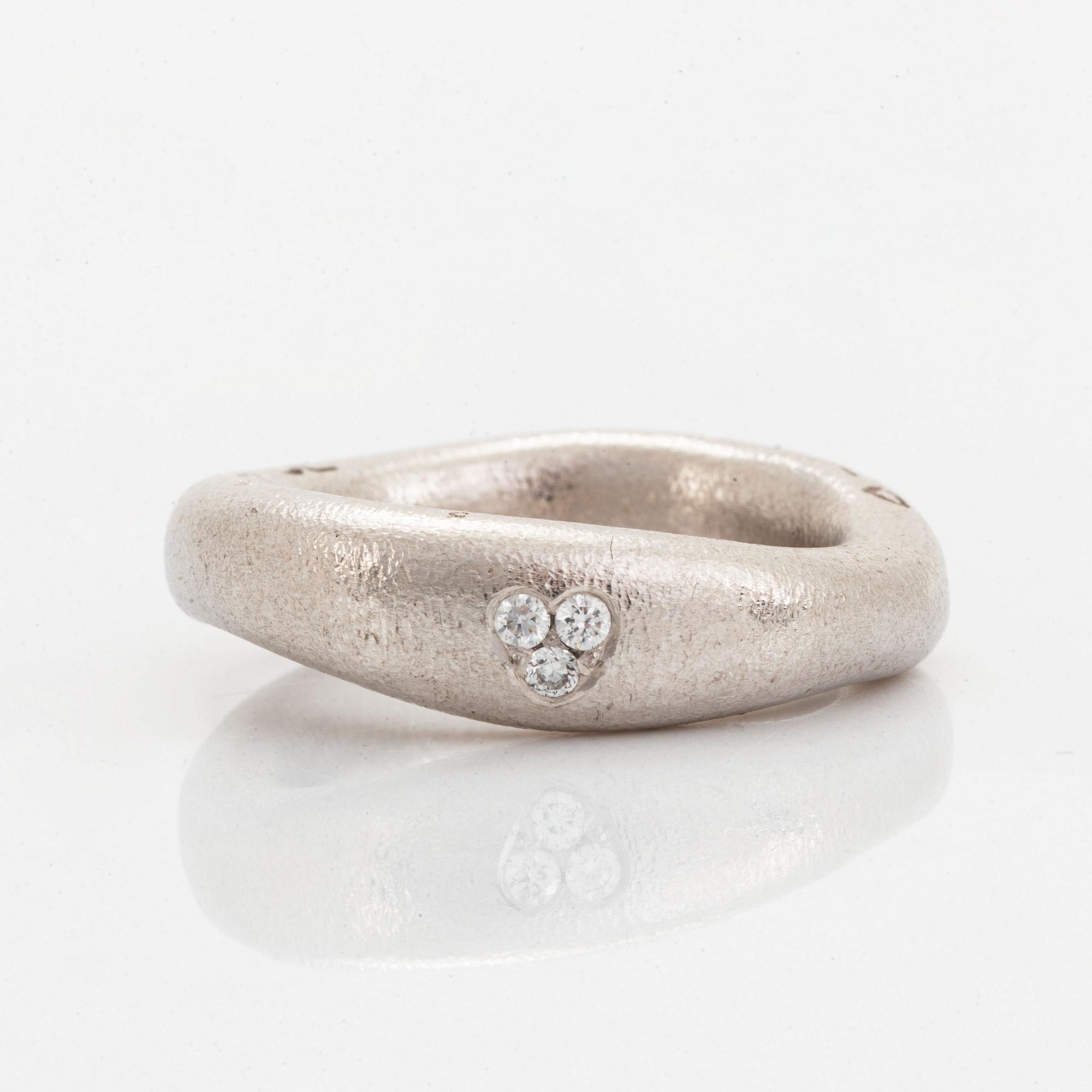 Ole Lynggaard "love ring" with brilliant-cut diamonds.