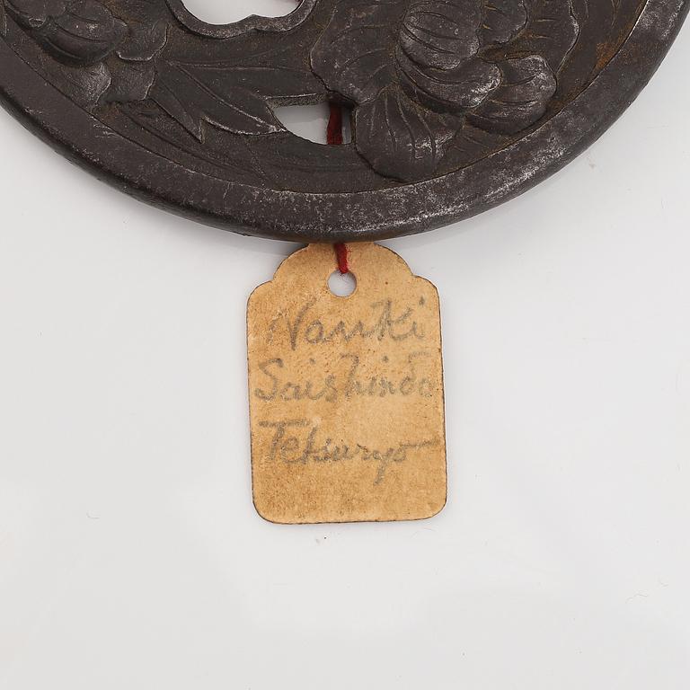 A Japanese iron Tsuba, Edo, signed Nanki Seishindo.