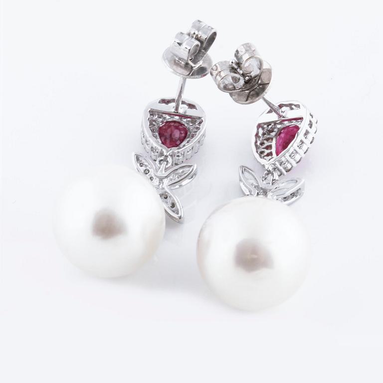 A pair of cultured pearl, ca 1.08 cts ruby and 0.34 cts brilliant cut diamond earrings.