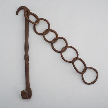 A 19th century iron hook and chain.