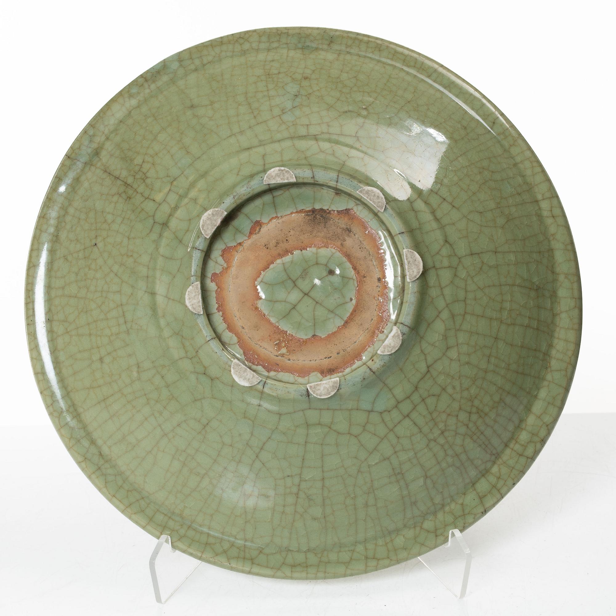 A large celadon glazed dish, Ming dynasty (1368-1644).