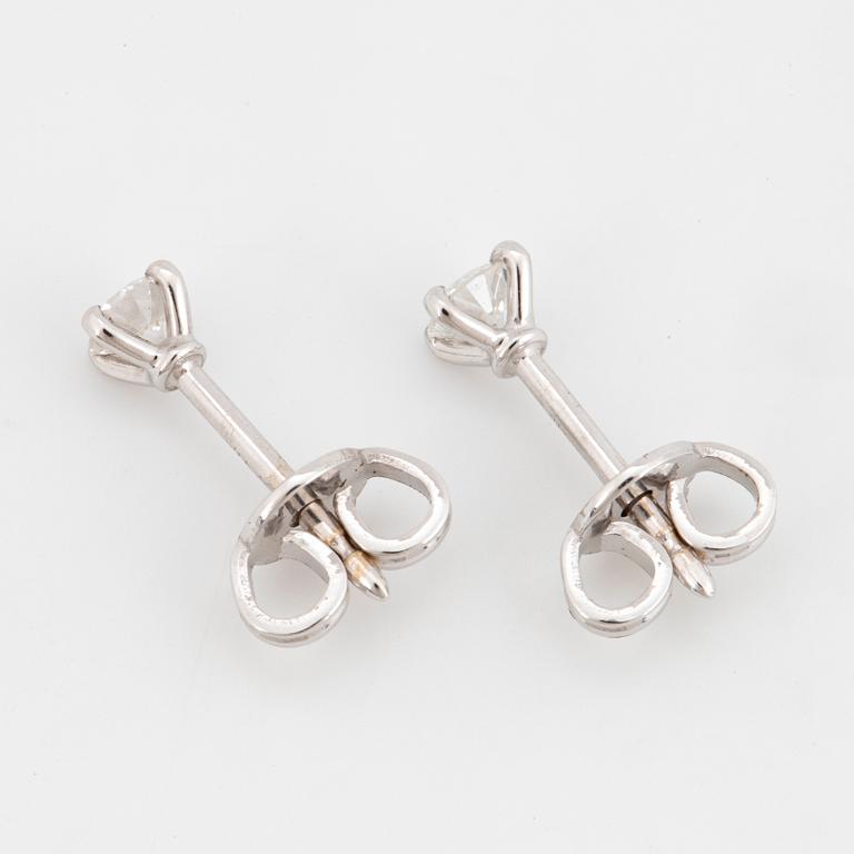 Brilliant-cut diamond stud earrings.