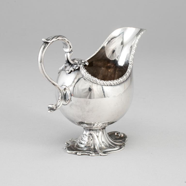 An English 18th century silver sauce-boat, unidentified makers mark, London 1764.