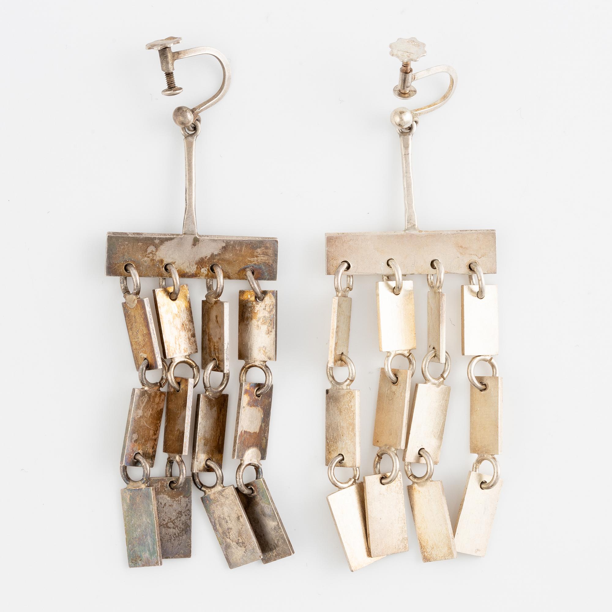 Lars Arby, a neck ring, two pendants and two pairs of earrings, silver, Gothenburg circa 1966, 1976, 1977 and 1980.