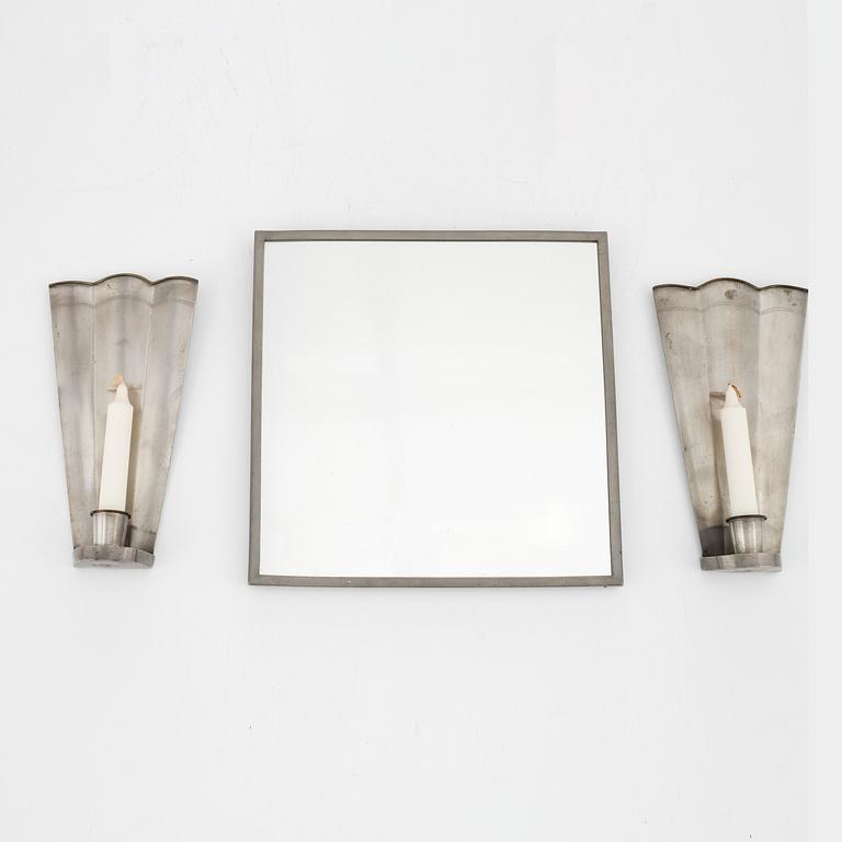 Nils Fougstedt, A pair of pewter sconces and a mirror, Firma Svenskt Tenn, 1940 and -29.