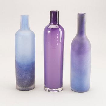 A set of three glass bottles Österlens glashytta 21st century.