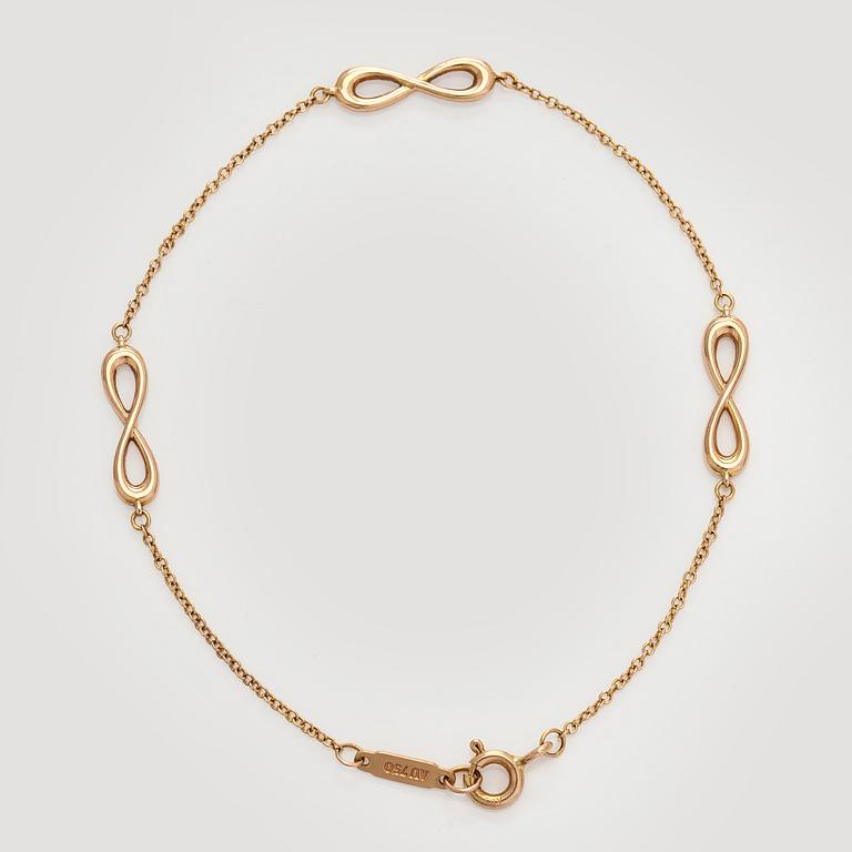 Tiffany & Co, an 18K gold 'Infinity Endless' bracelet.