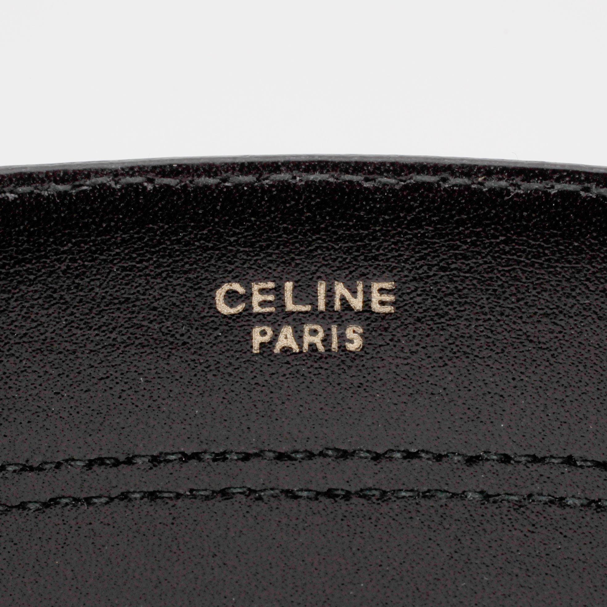 CÉLINE, a striped leather belt.