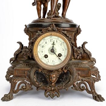 A metal table clock around 1900.