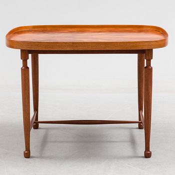 A mahogany veneered model 974 side table from Svenskt Tenn.