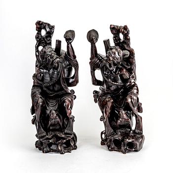 A pair of Japanese wooden sculptures, early 20th Century.