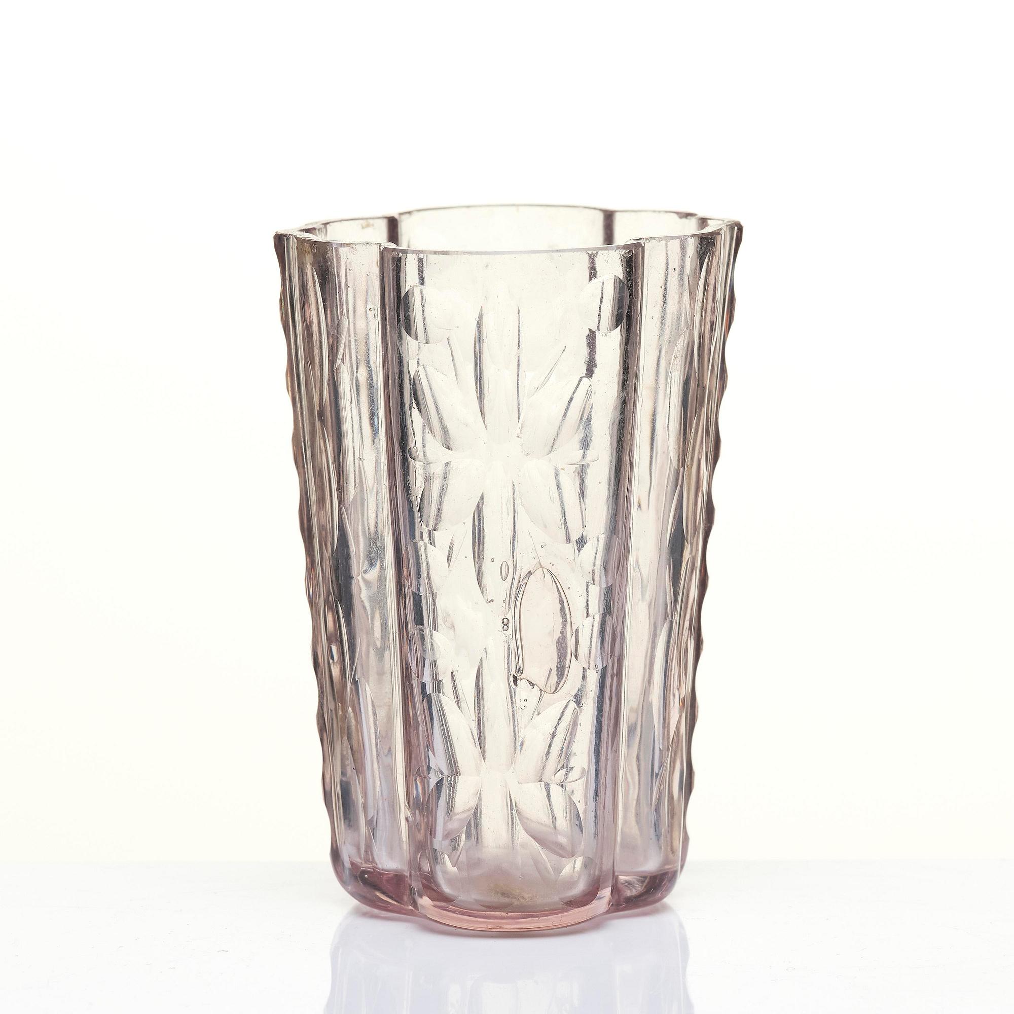 An amethyst coloured suger shaker and a cut glass goblet, 18th century.