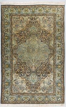 An old part silk oriental rug, ca 278 x 178 cm.