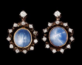 640. A pair of Russian gold/silver, diamond and blue star sapphires.