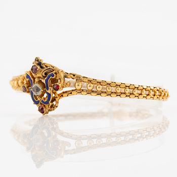 Bracelet, gilded metal with paste stones and enamel.