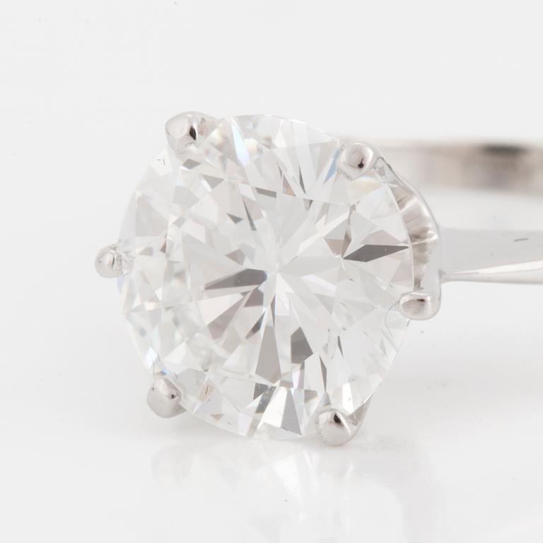 A SOLITAIRE RING set with a round brilliant-cut diamond.