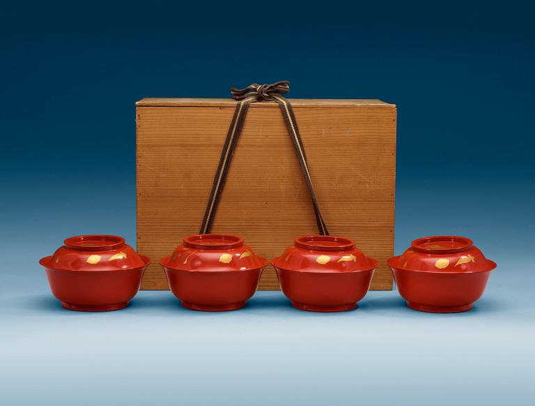A set of eight red lacquered Japanese bowls with covers, first half of 20th Century.