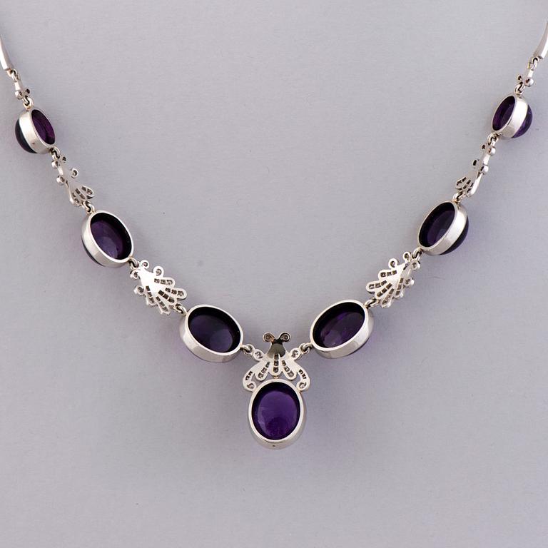 A NECKLACE, BRACELET, EARRINGS and RING, amethysts, diamnonds, 18K white gold and palladium. A. Tillander, 1970s.