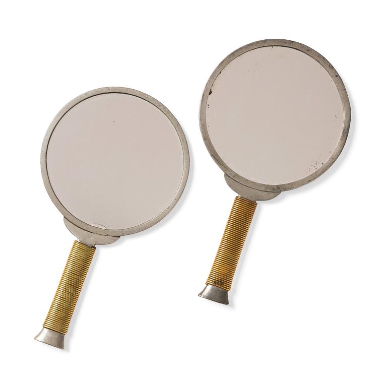 Estrid Ericson, & Björn Trägårdh, a pair of pewter and brass hand mirrors model "A 1444", Firma Svenskt Tenn.