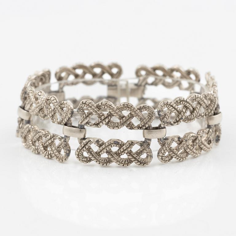 Armband vit metall.