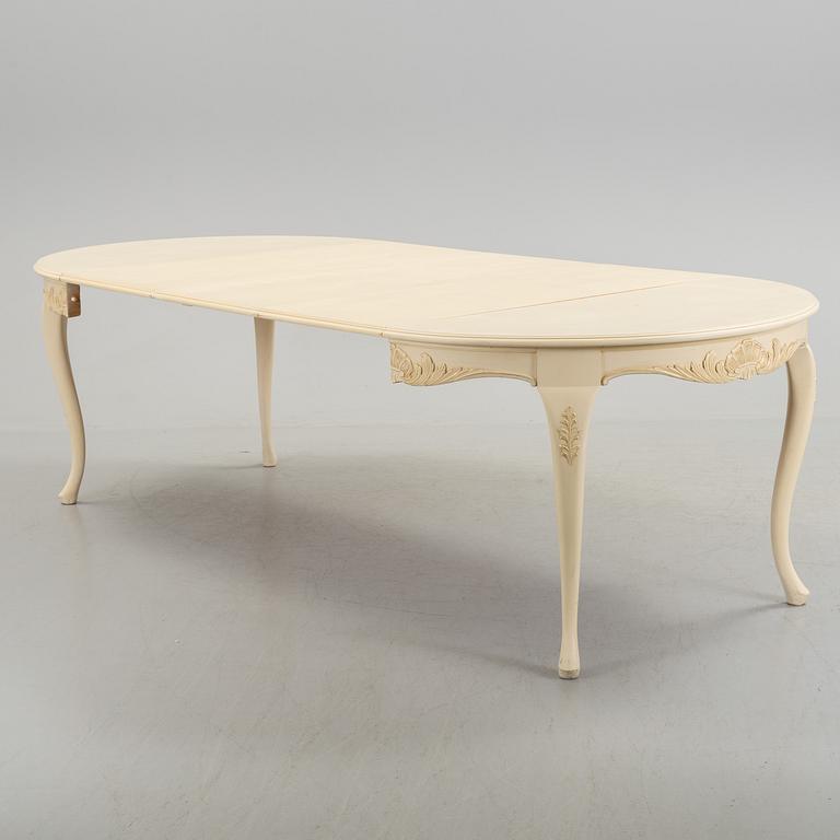 A mid 20th century rococo style dining table.